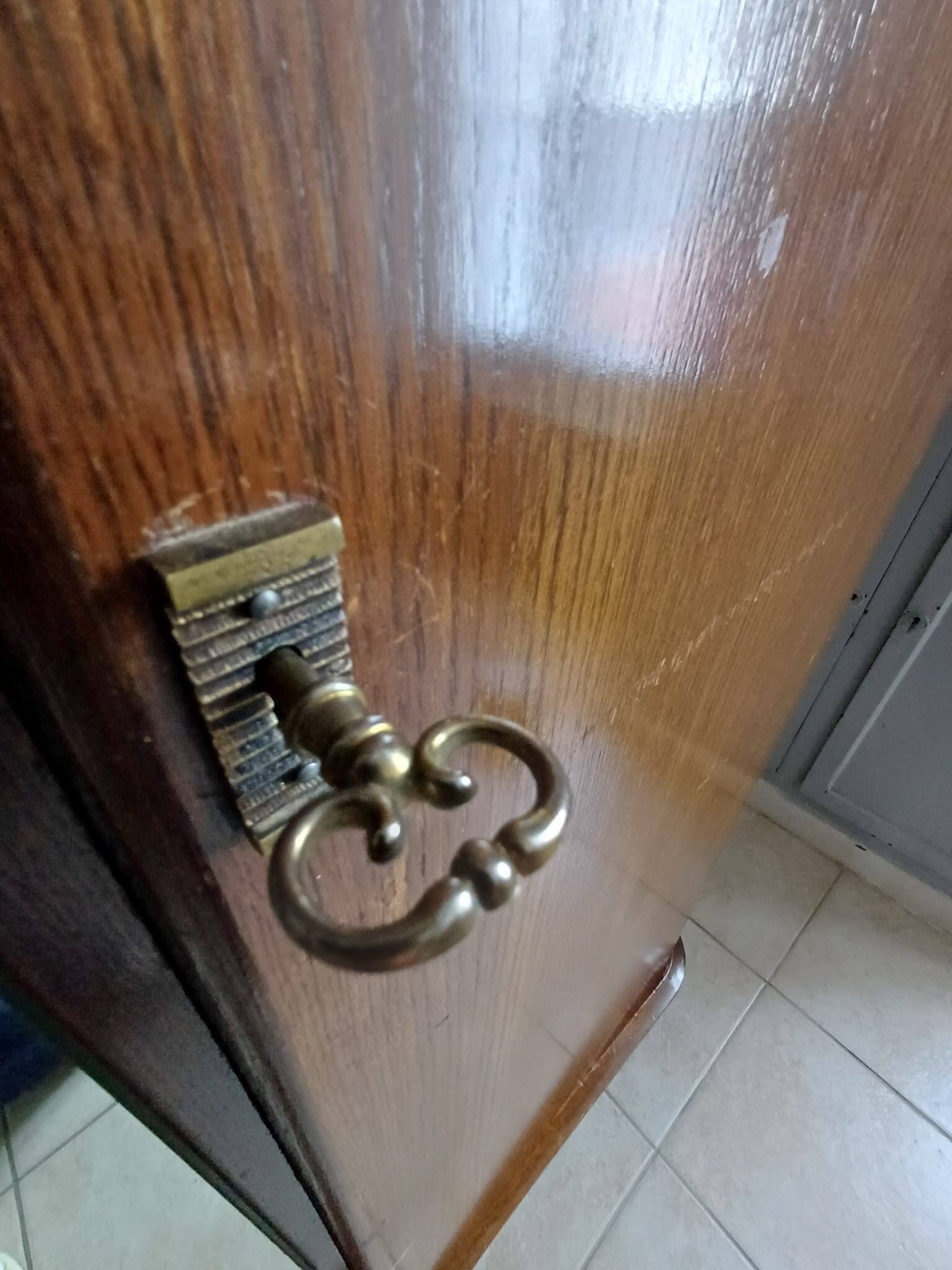 Vintage 1960s wooden wardrobe with a central mirror and tapered legs.