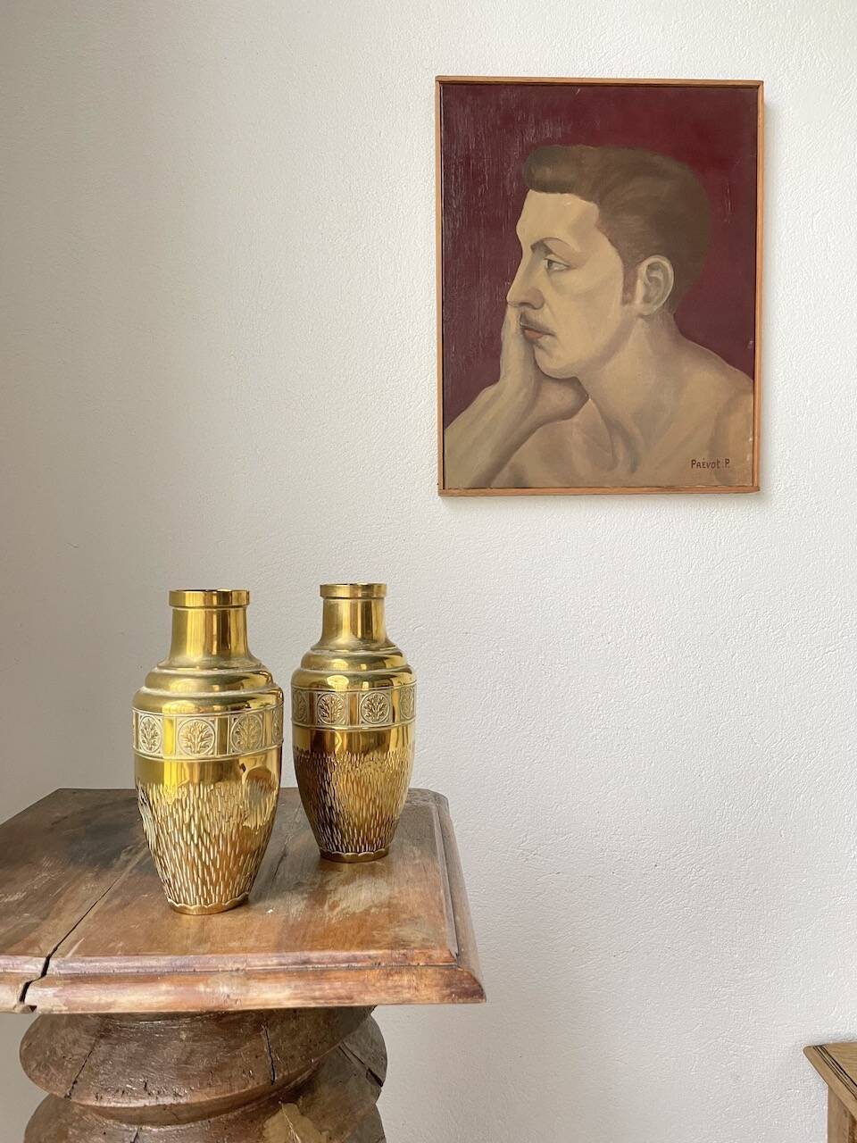 Duo of embossed brass vases