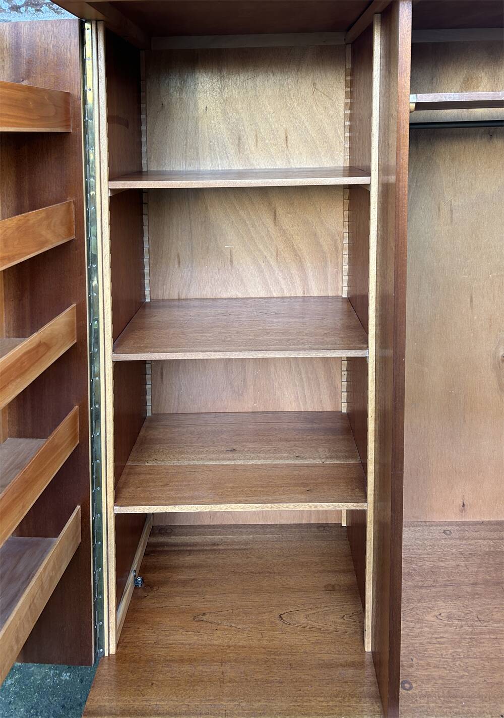 Mid-century wardrobe from the 1960s in wood, with a chevron front and tapered legs.