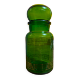 Green apothecary jar with golden patterns