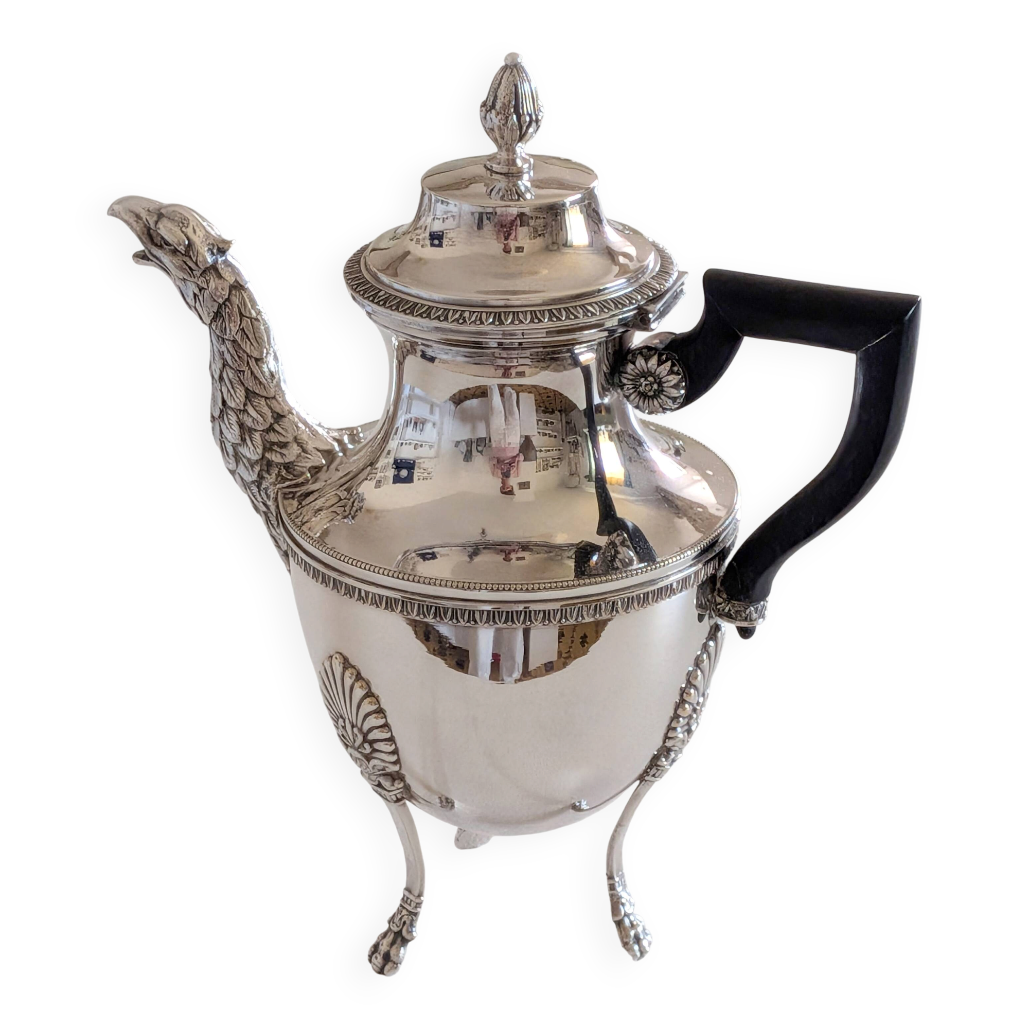Empire-style silver-plated coffee pot with eagle head spout.