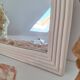 Miroir biseauté et mouluré beige