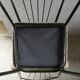Pair of Colette Gueden chairs, black metal and fabric.