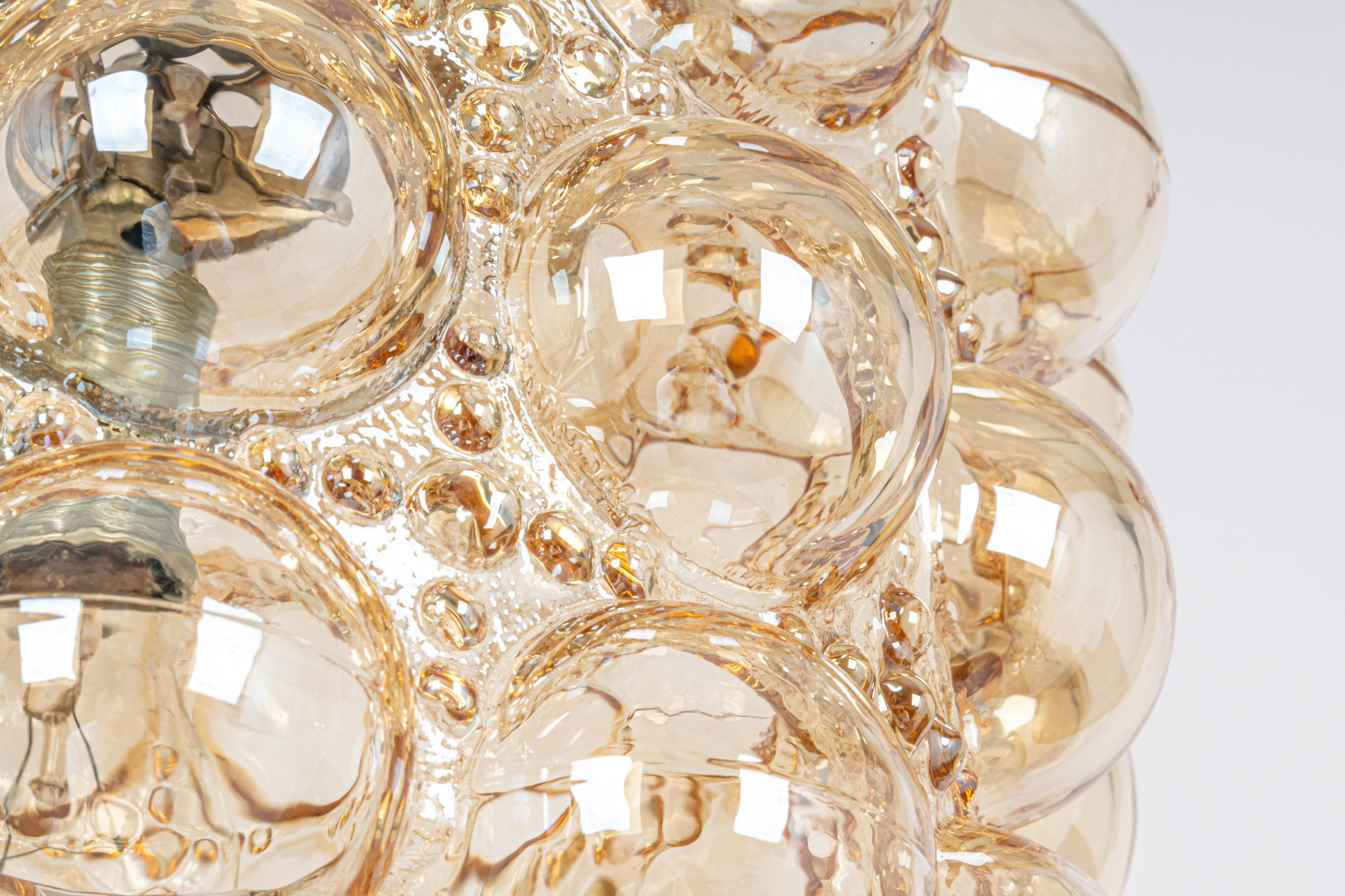 Large amber bubble glass pendant light by Helena Tynell for Limburg, Germany, 1970s.