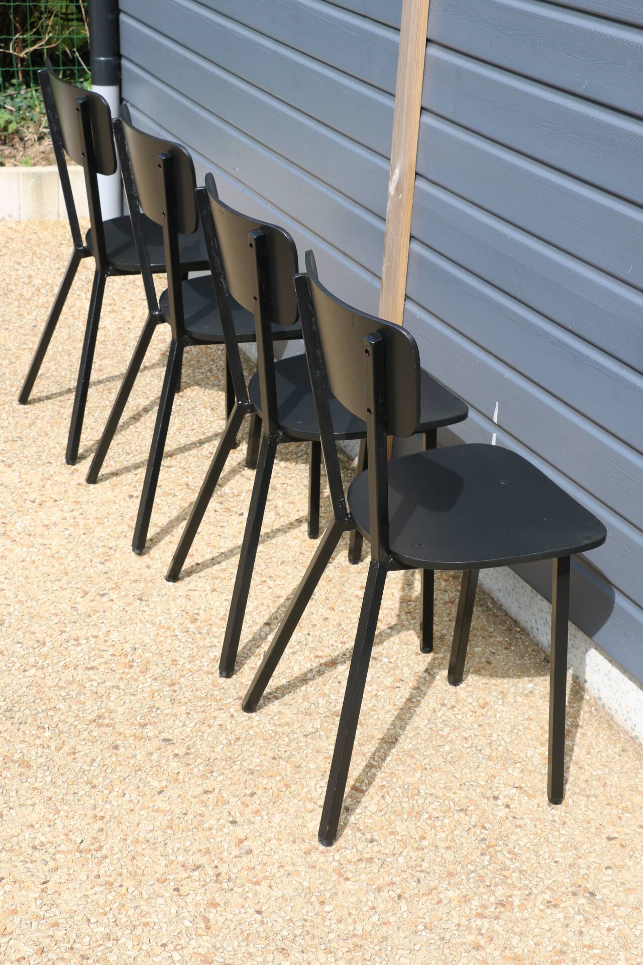 4 black metal and wood chairs