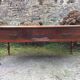 Old farmhouse table with cherry and chestnut panels with 3 drawers.