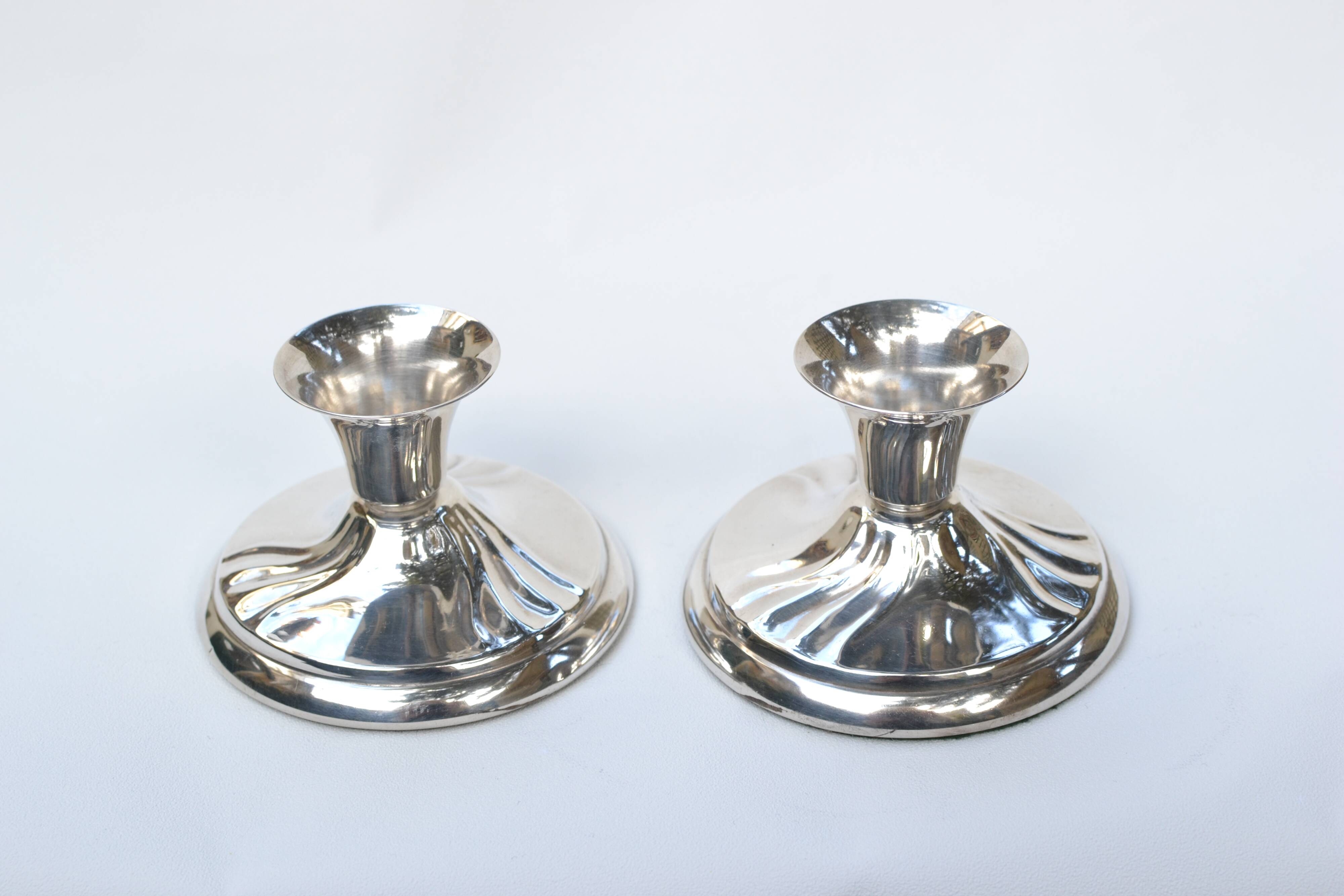 Pair of silver metal candlesticks