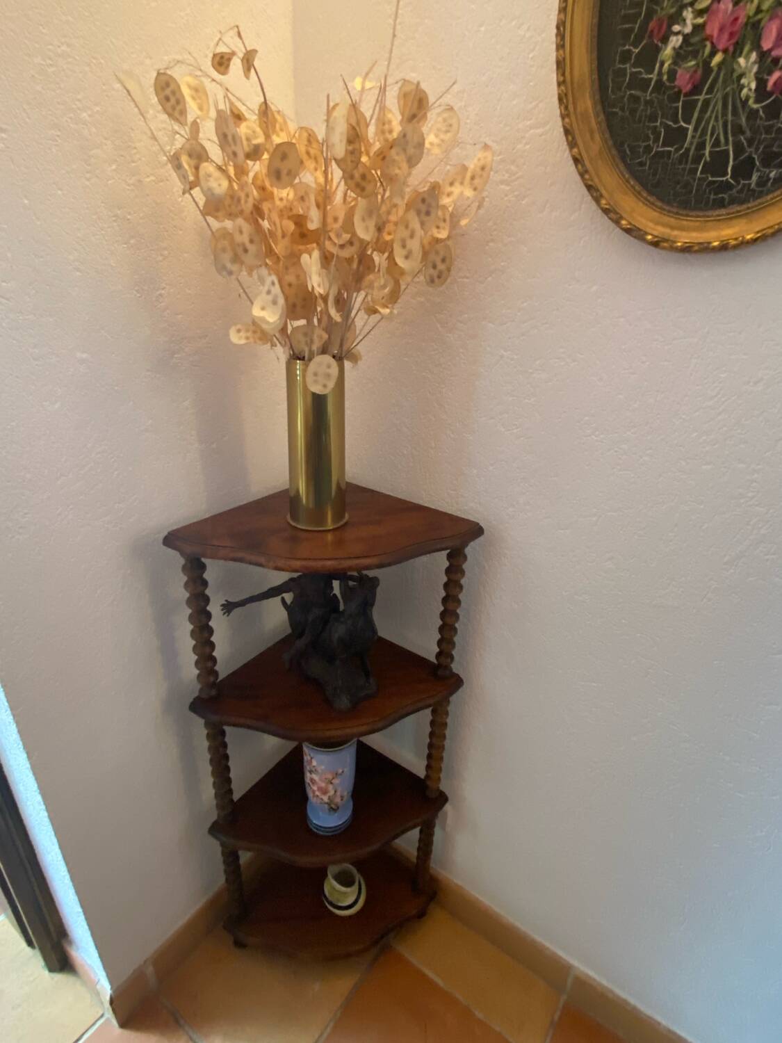 Corner shelf on a turned wooden stand