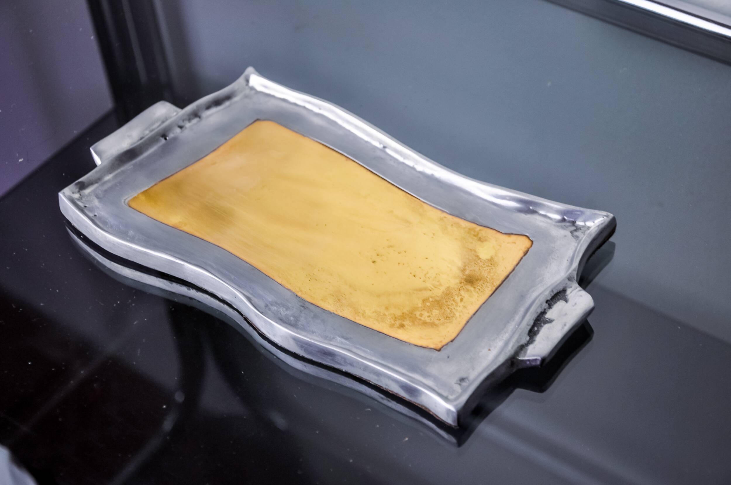 Brutalist pocket emptier by Leopold, bronze and aluminum 1970, Spain