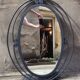 Miroir ovale vintage en fer forgé à décor de spirales
