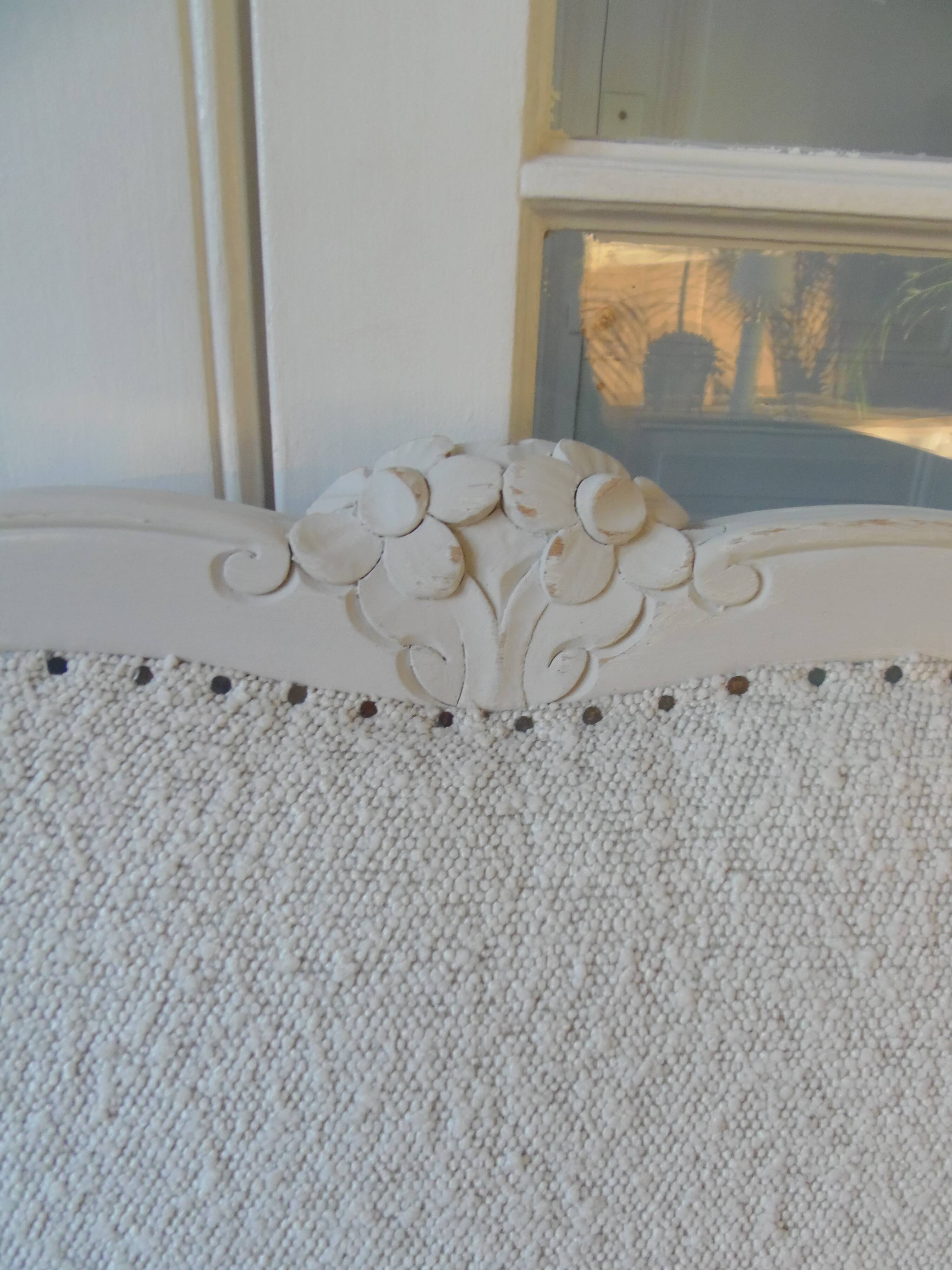 Louis XV style headboard with pearl grey patina, upholstered in off-white bouclette.