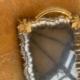 Silver metal top and decoration of foliage and handles in vintage brass