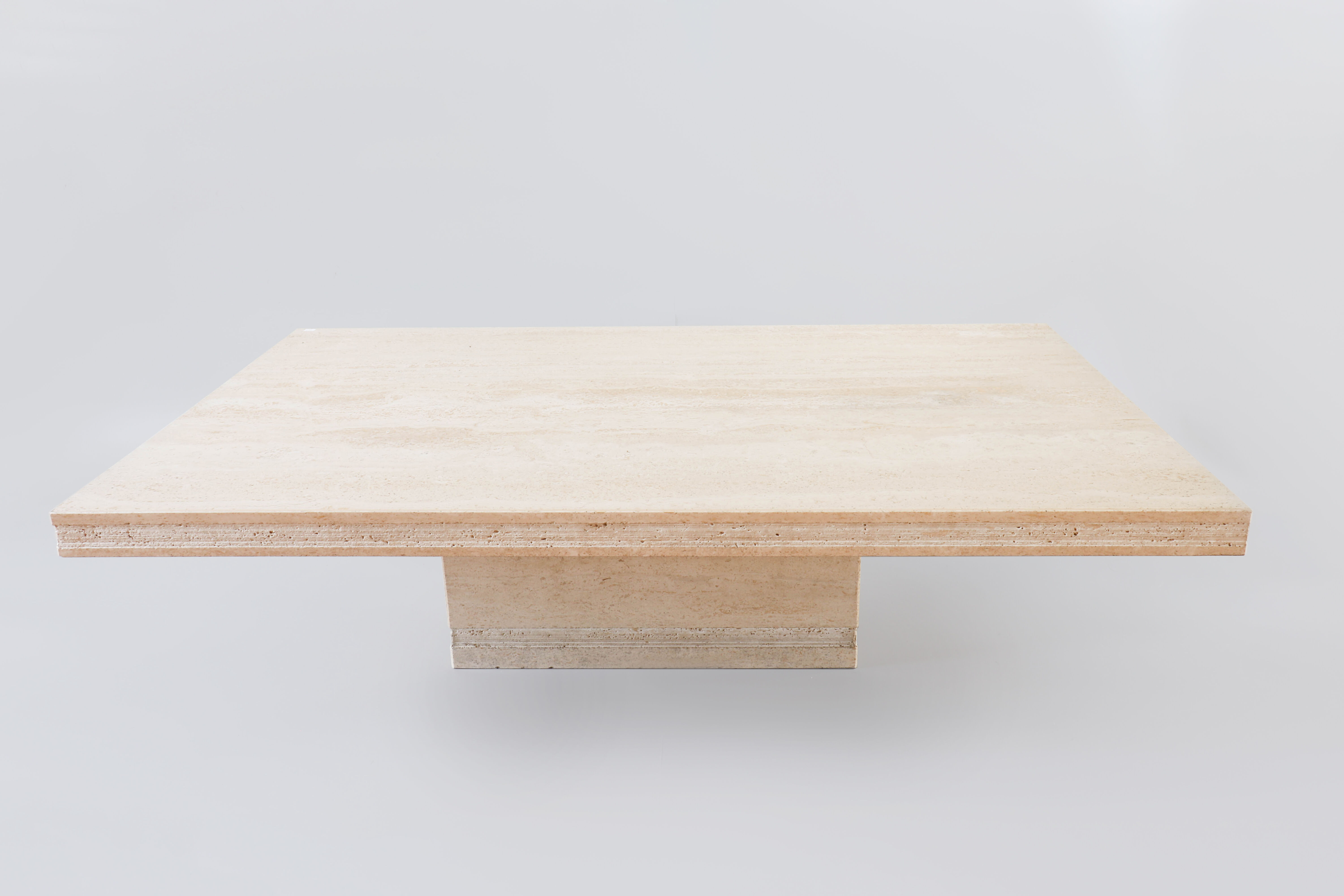 A vintage travertine coffee table