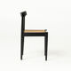 Mid-century dining chair in black laquered wood and cane