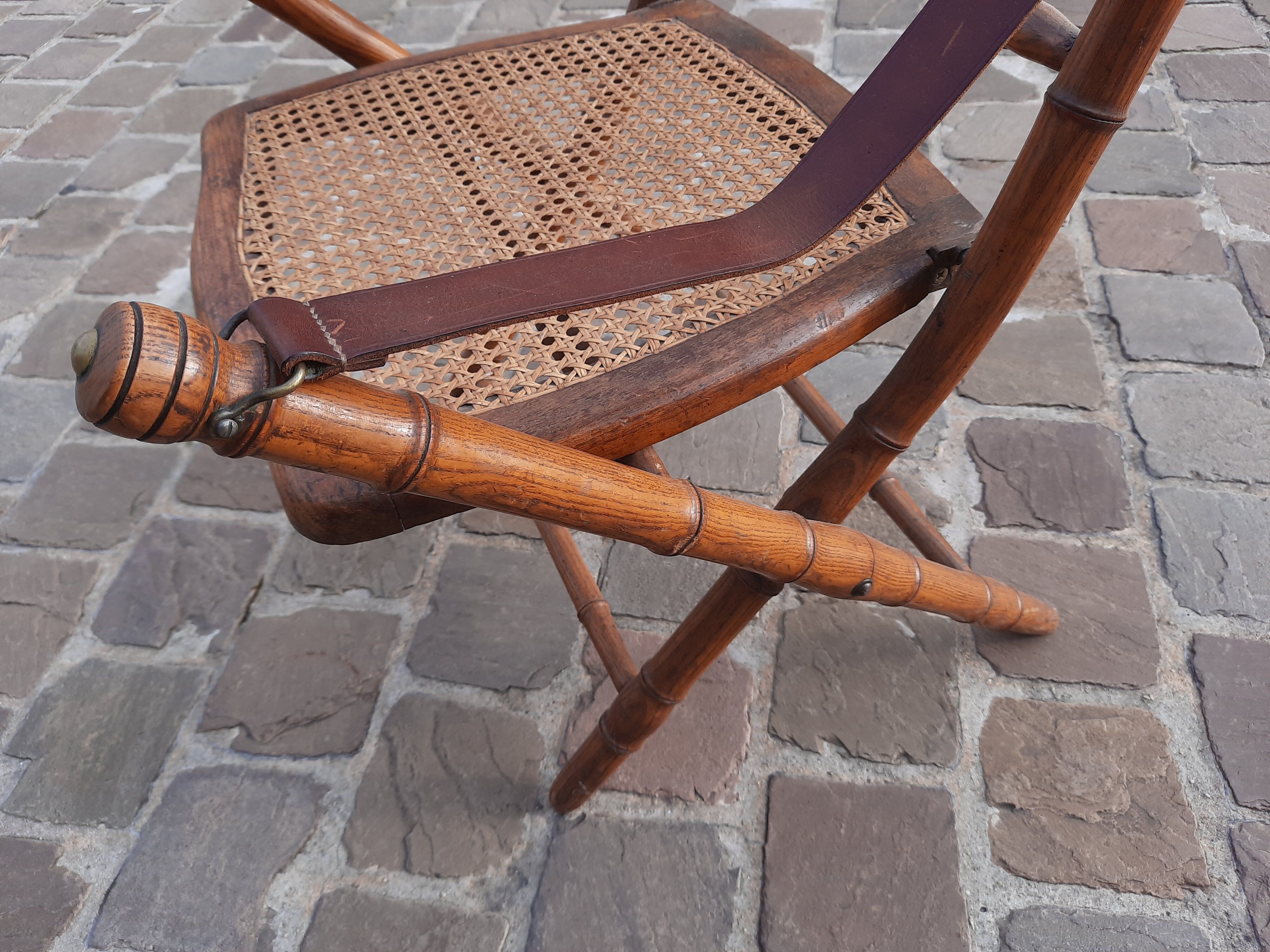 Bamboo folding chair and caning, leather and brass