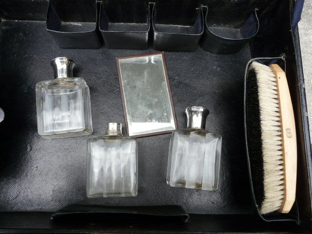 Leather suitcase with baron's crown and mw monogram