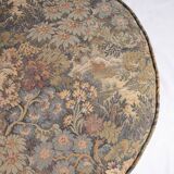 Upholstered pouf in verdure tapestry style, France, late 19th century.