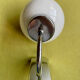 Pair of chrome metal wall lights with white glass globe.