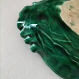 Vintage green slipware bowl in the shape of a cabbage leaf.
