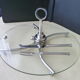 Cheese platter made of glass and silver metal and its serving cutlery
