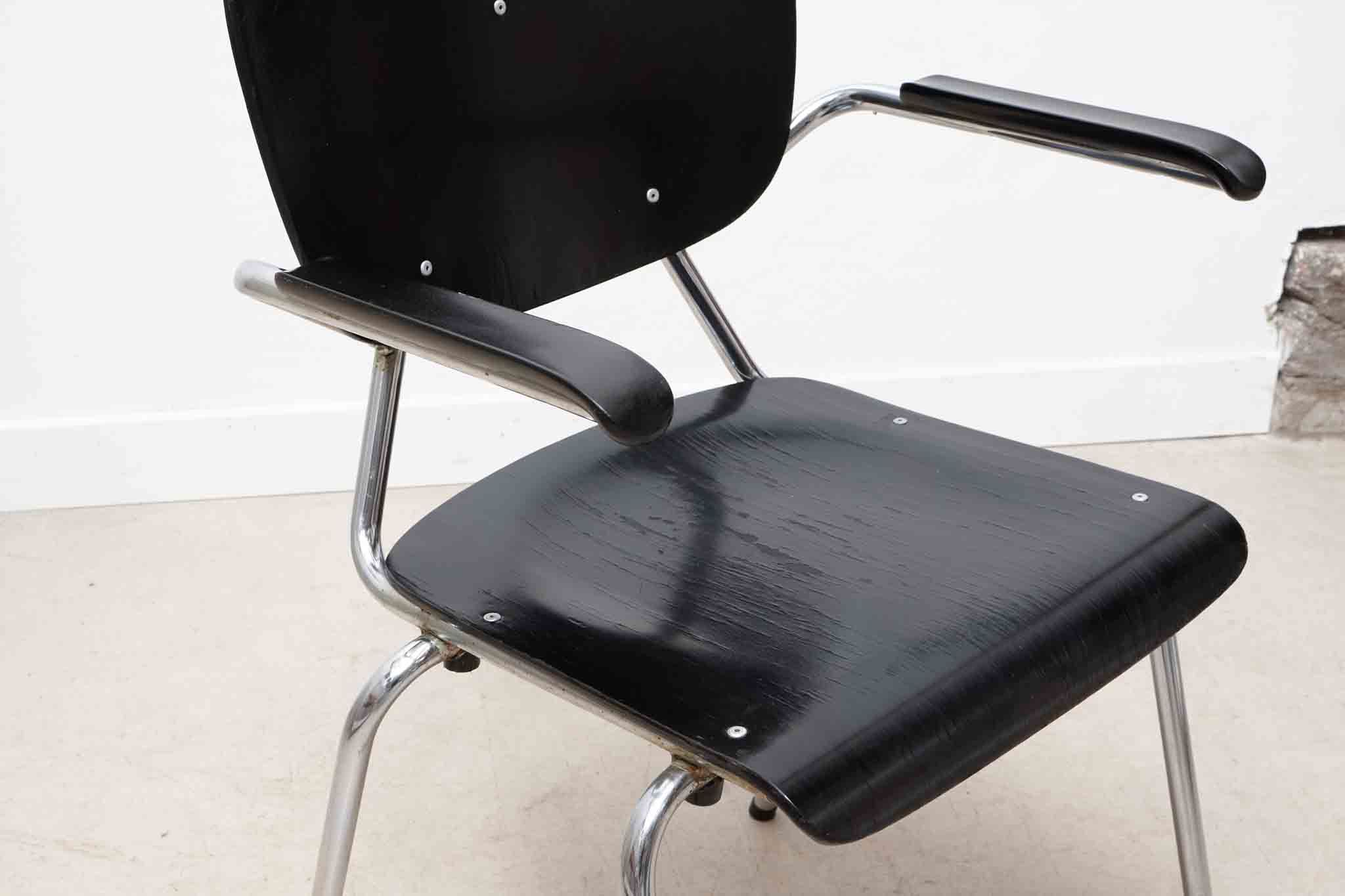 Vintage chair Kho Liang Black and metal with armrests