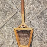 Old wooden tennis racket with frame