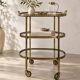 Desserte en laiton sur roulettes