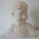 Bust young boy in plaster