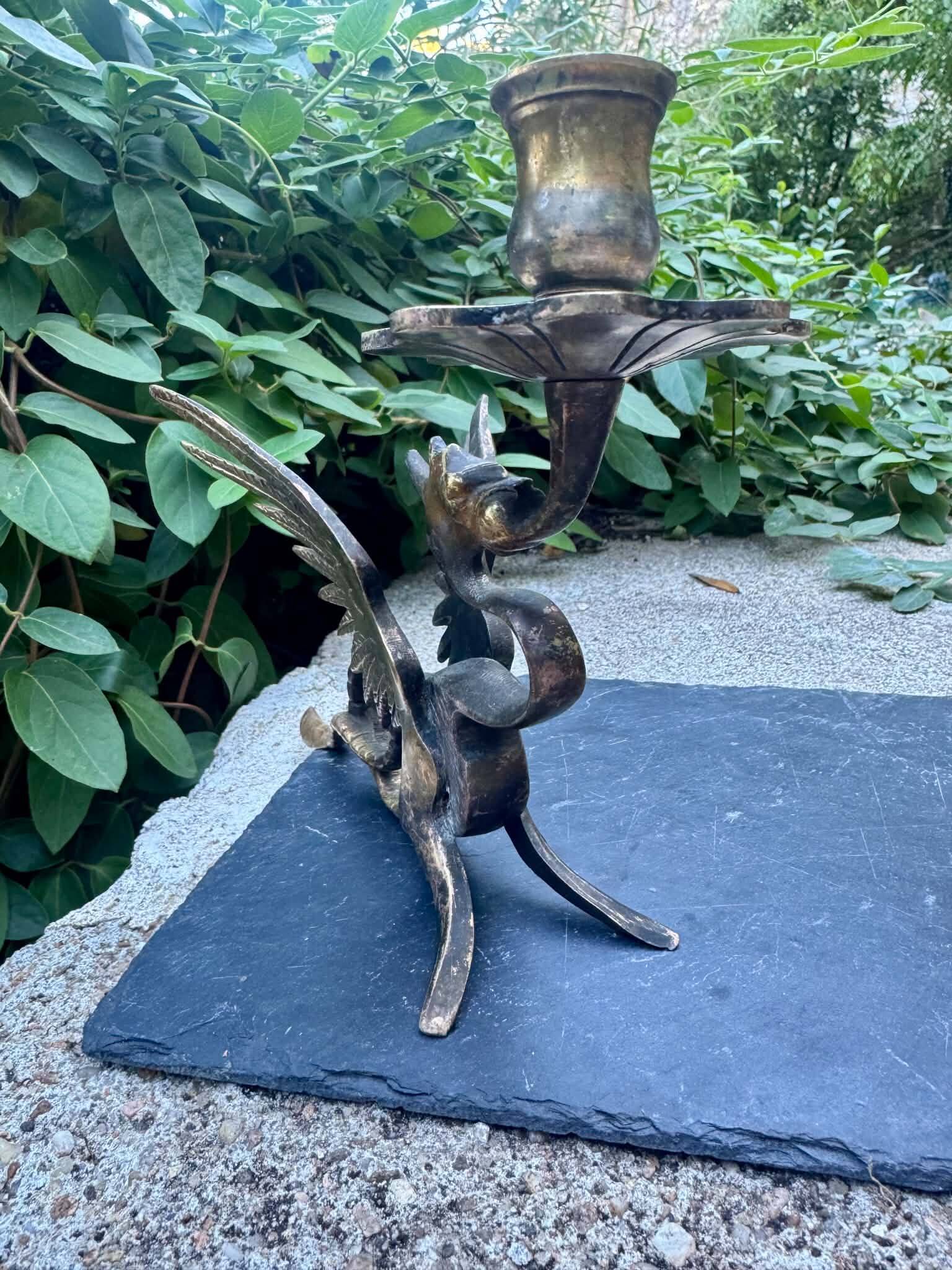 Pair of chimera candle holders in bronze, 19th century.
