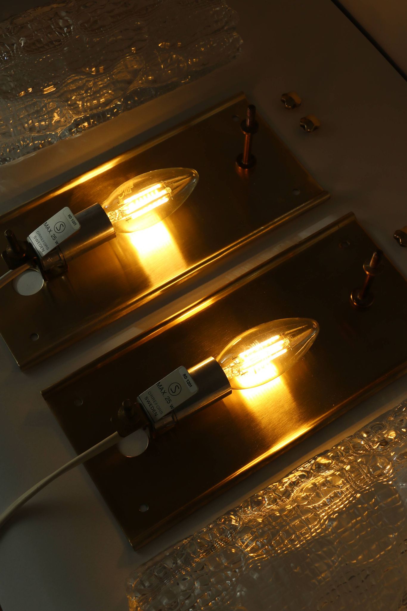 Pair of glass and brass wall lights by Carl Fagerlund for Orrefors, 1960.