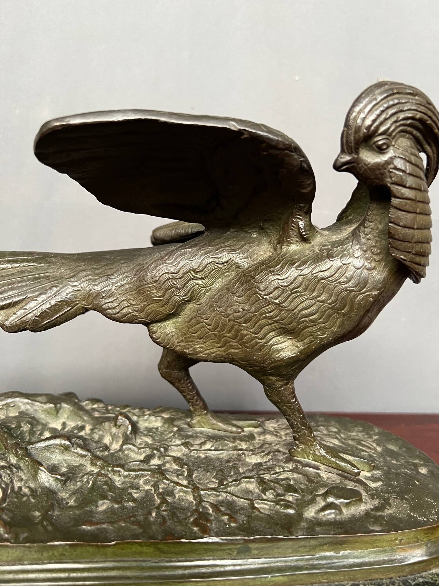 Rene Andre Varnier. Bronze figure of a pheasant on a green marble base.