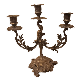 Antique metal candlestick with three branches