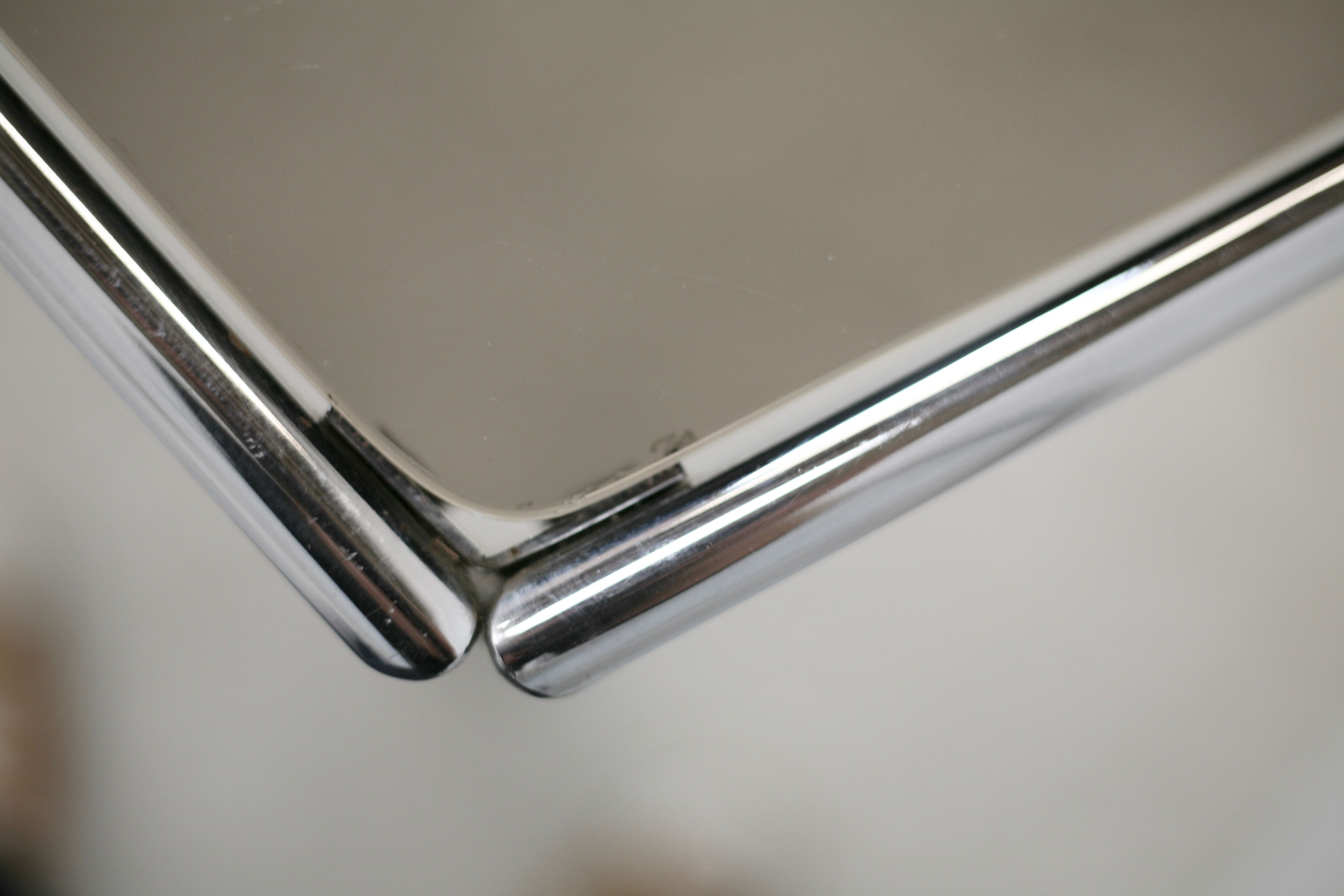 Living table. chrome metal, curved smoked glass slab, france, circa 1970.