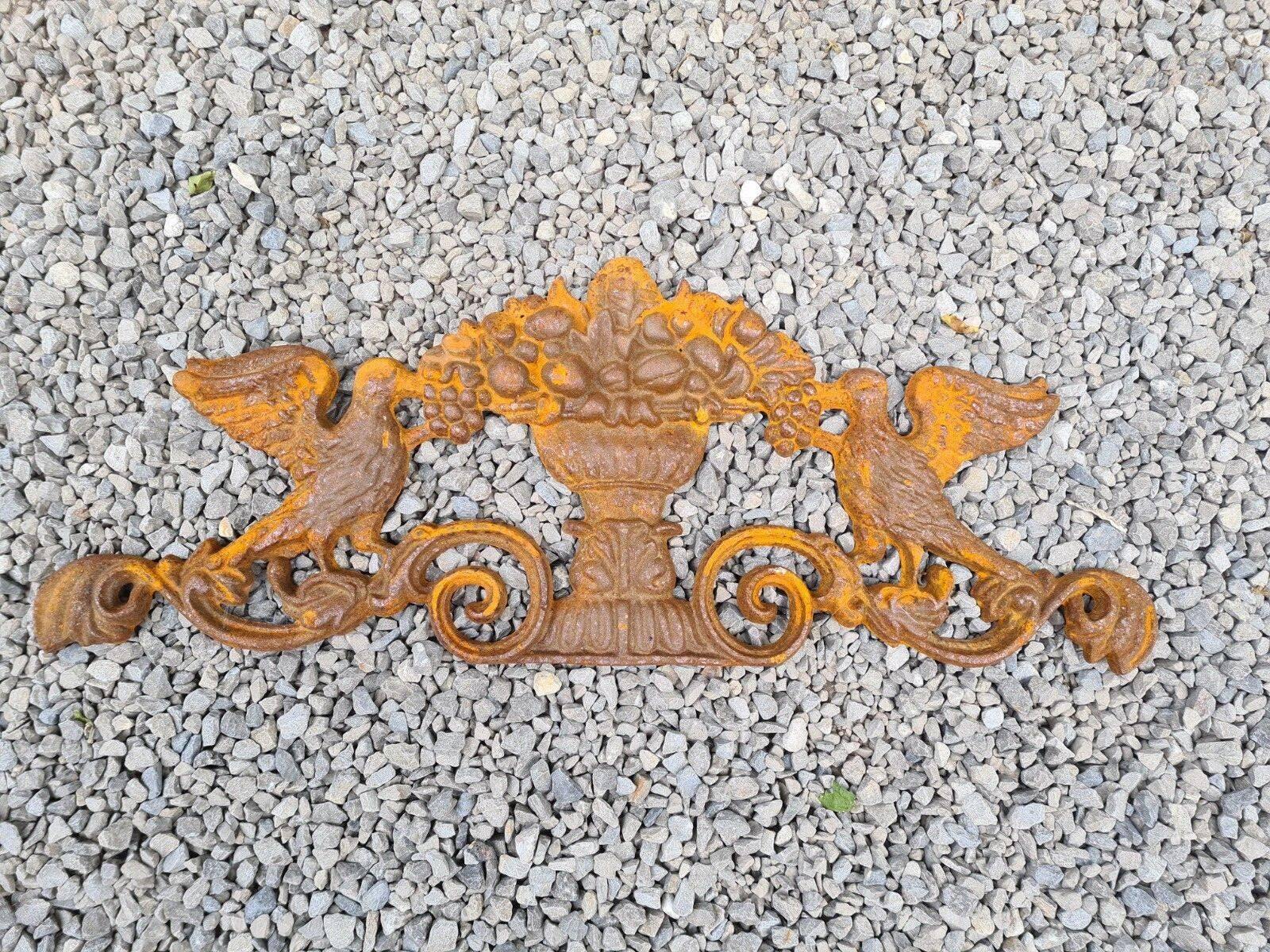 Cast iron pediment with birds