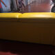 Yellow leather convertible sofa made in Italy.