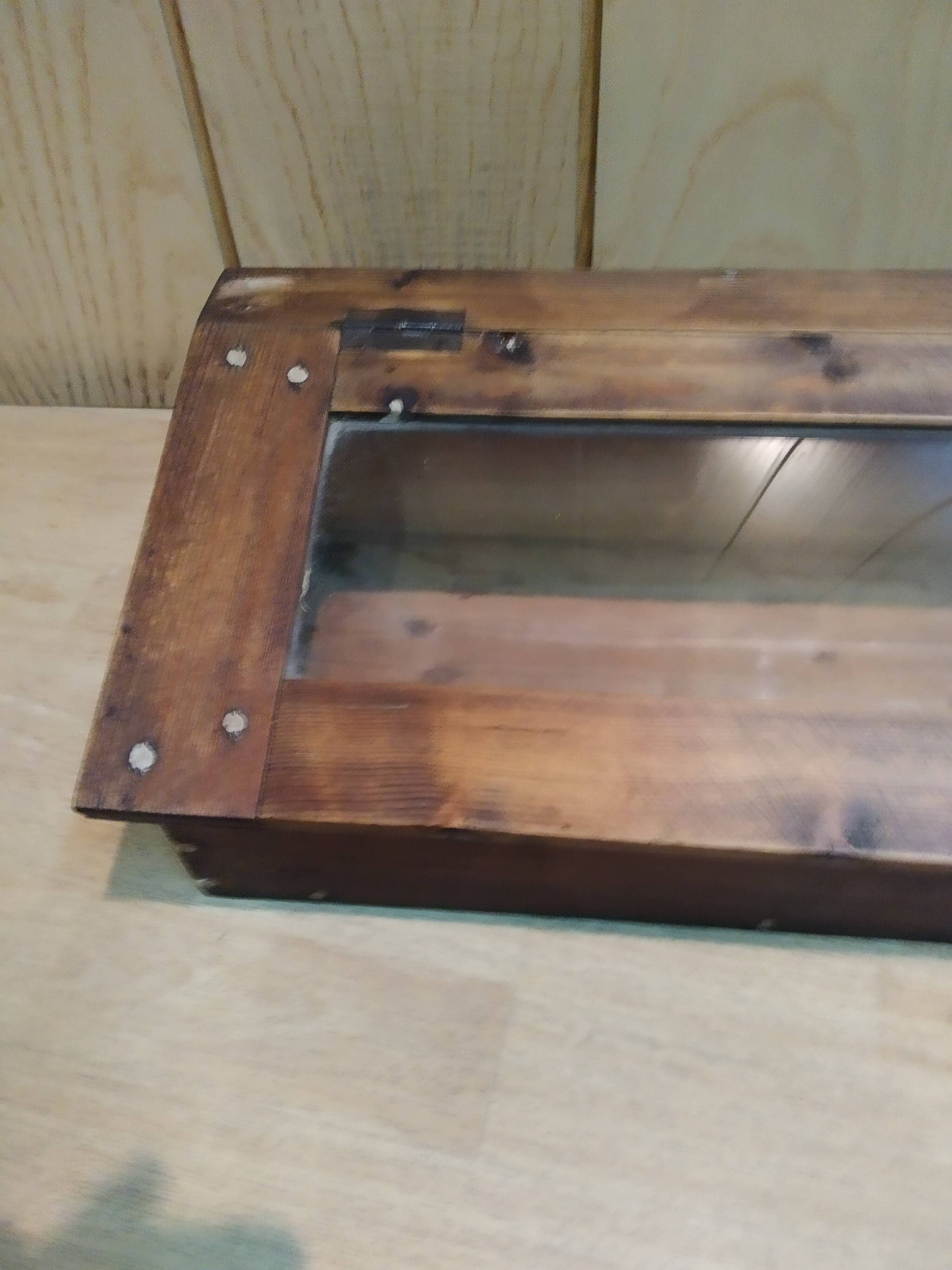 Former wooden display case