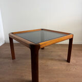 Square wooden coffee table with glass.