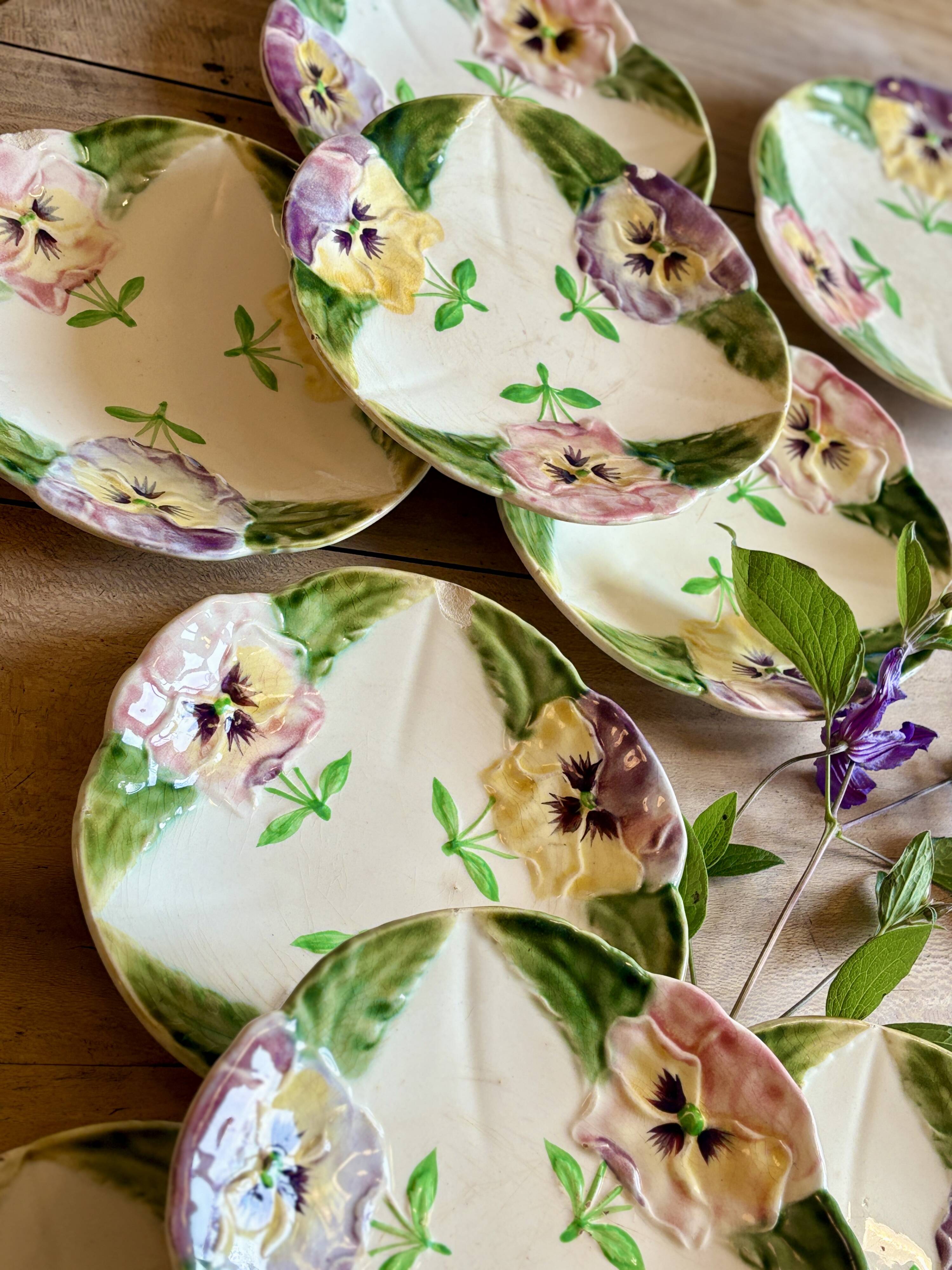 Set of 10 antique slip plates with flower decorations
