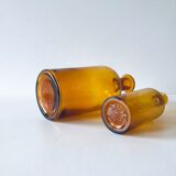 Duo of ancient apothecary flakes in amber glass