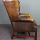 Fauteuil en cuir de vachette patiné