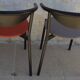 4 gondola-style chairs with a sturdy metal frame and faux leather.