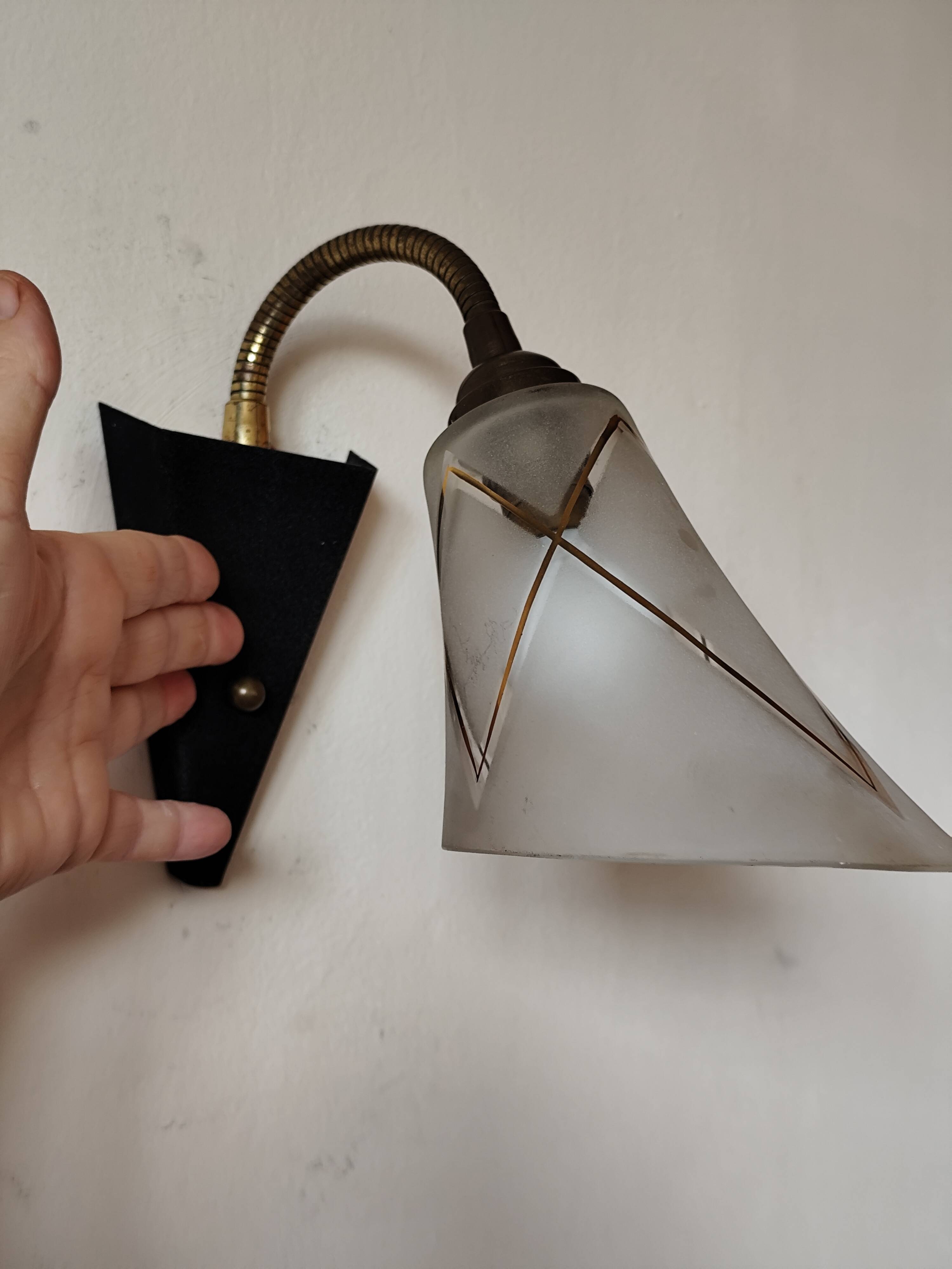 1950s wall lamp, metal, flexible brass stem and opaque shade.