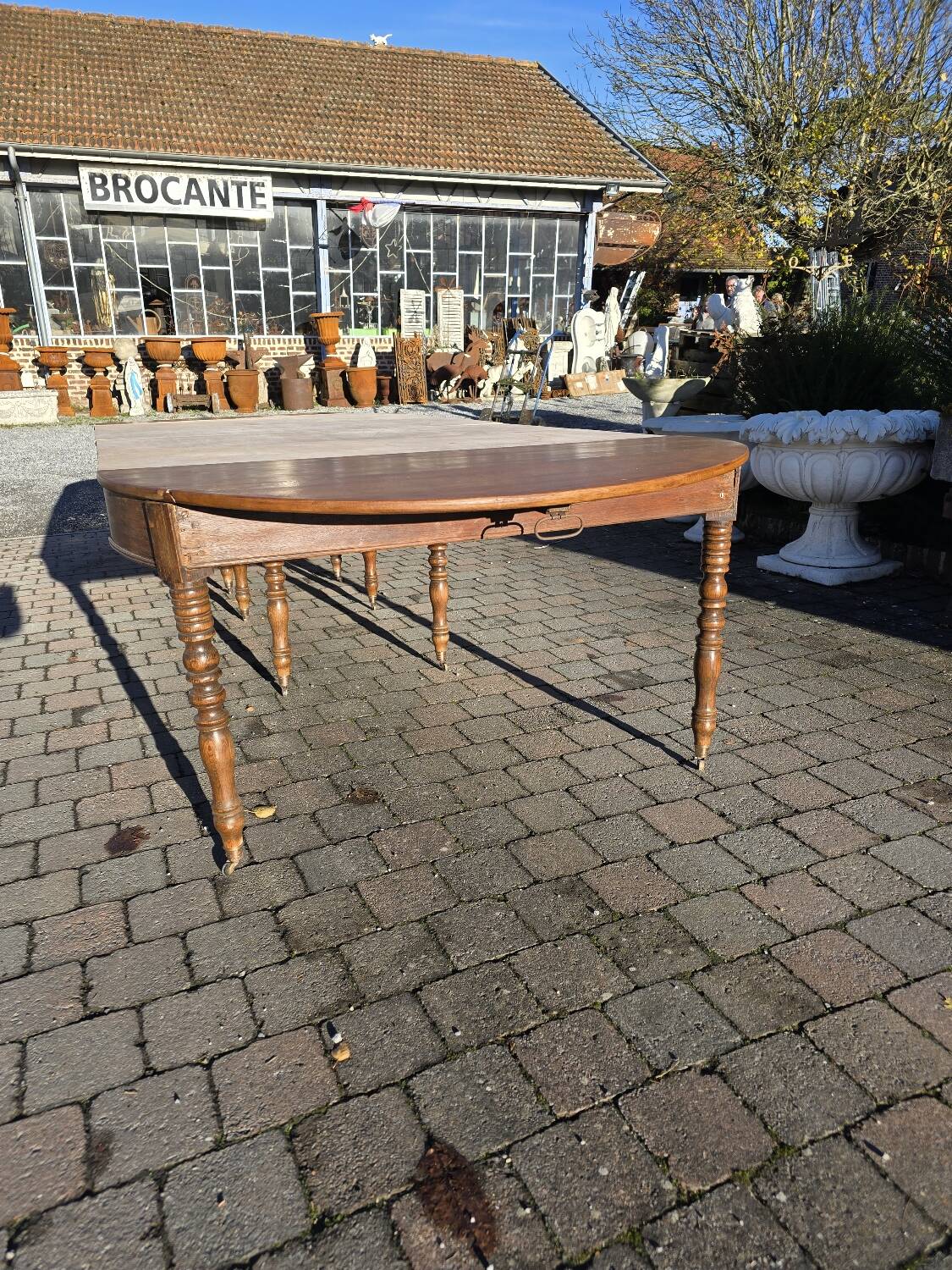 12-foot round oak table with 7 extensions / 20 people