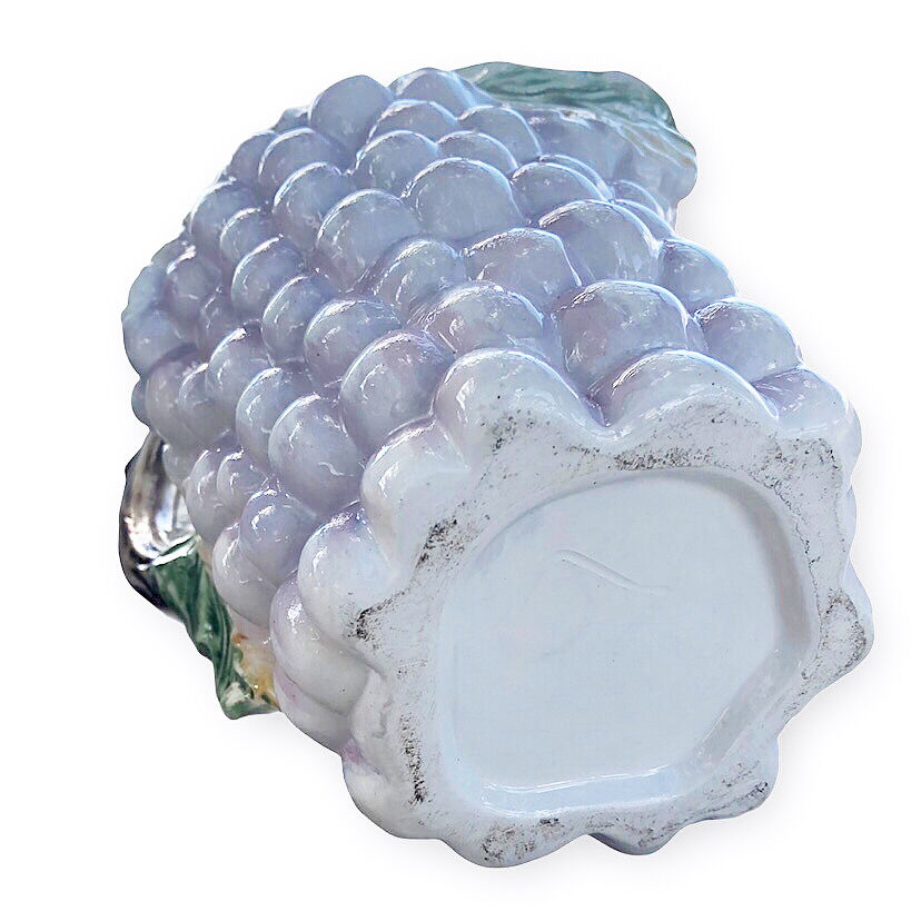 Old bunch pitcher of dabbling grapes