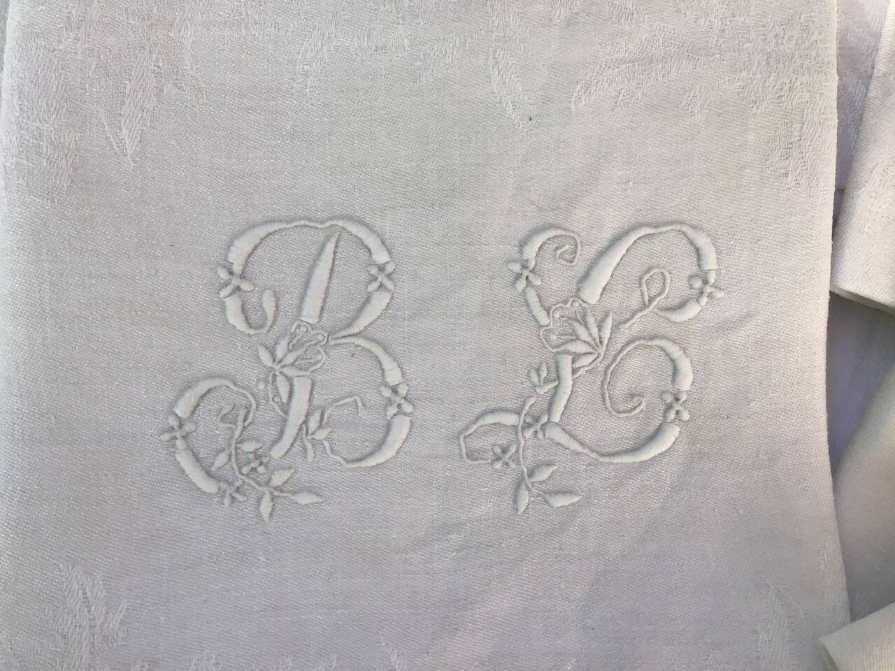 Set of 12 19th century white napkins marked “BL”