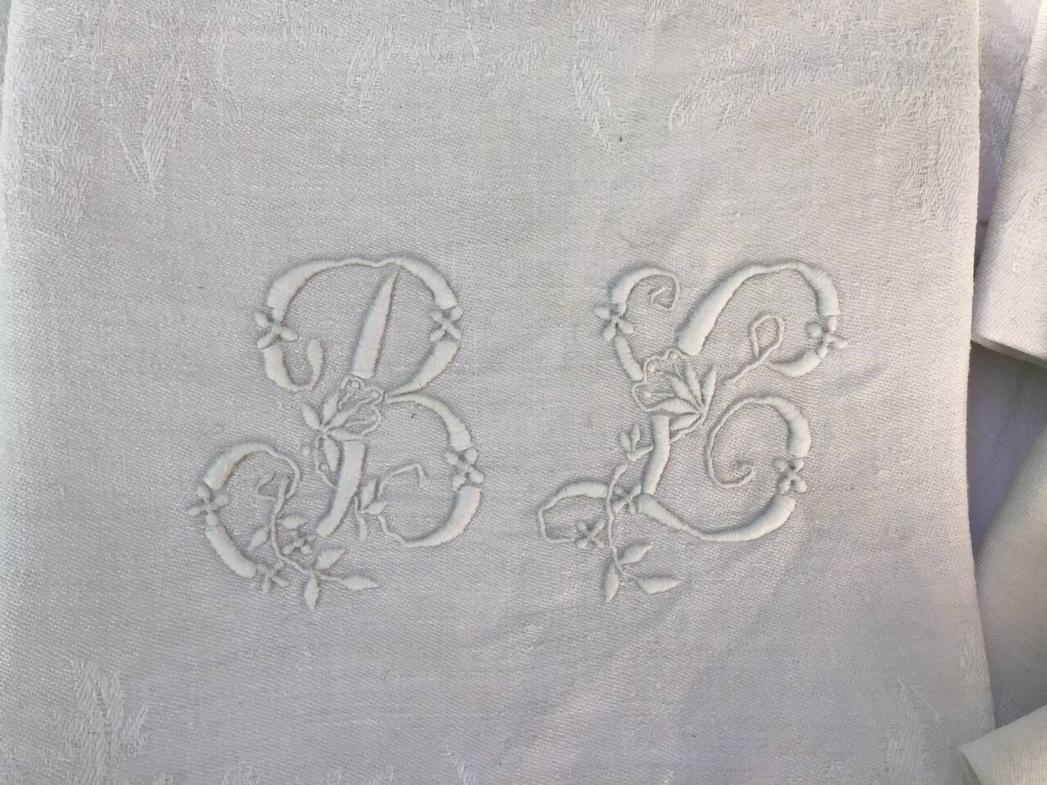 Set of 12 19th century white napkins marked “BL”