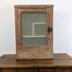 Small glass wall cabinet from the 1960s.