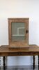 Small glass wall cabinet from the 1960s.