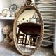 Miroir ovale classique doré à décor de noeud