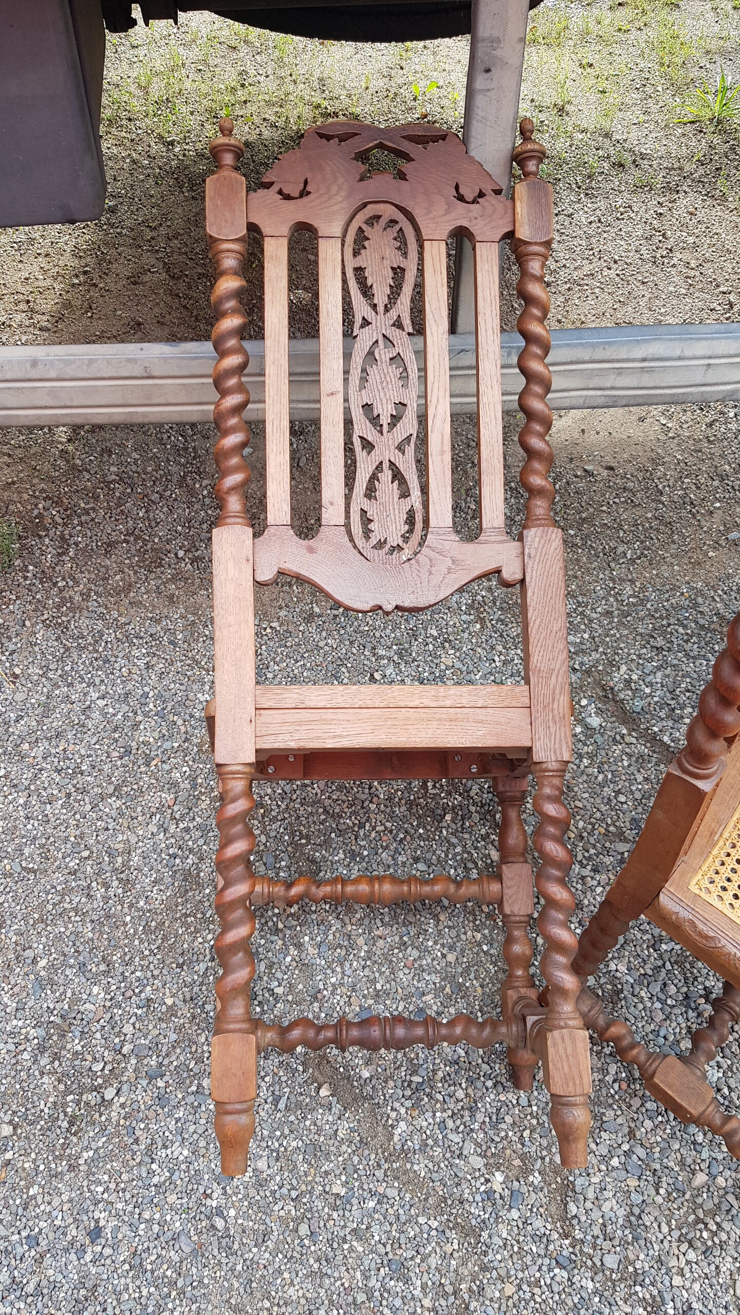 Carved antique chairs with rattan seat